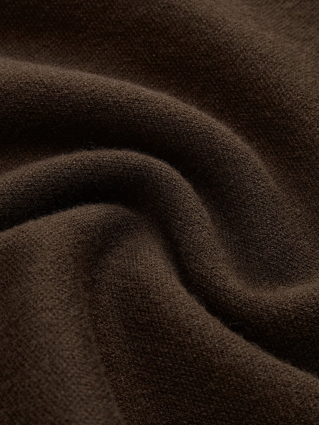 Flat lay of the Noira mock neck sleeveless knit top showing padded shoulder and knit texture detail