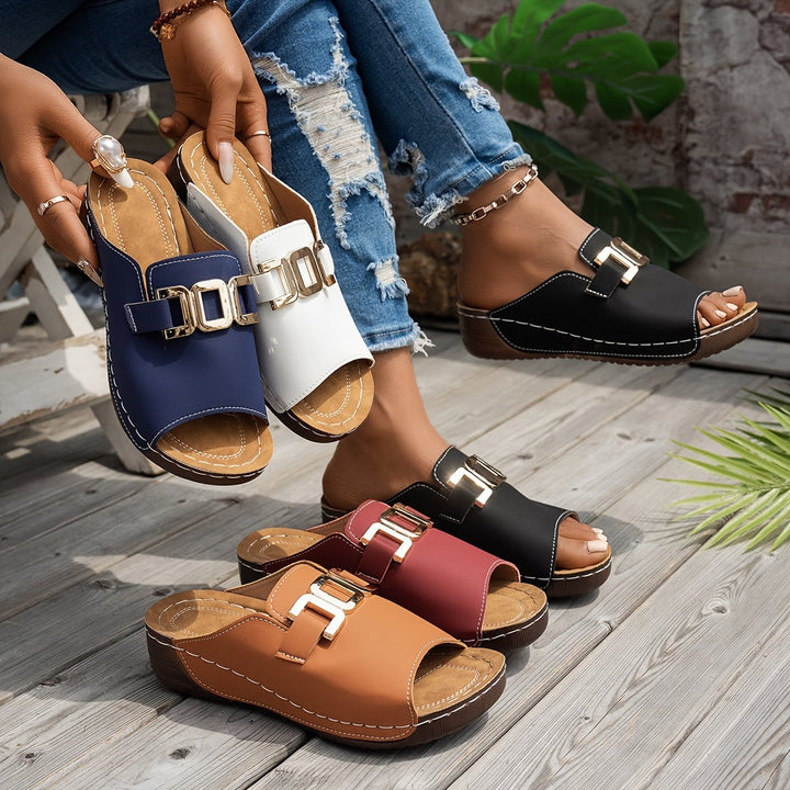 Nola women's sandal in white, side profile showing modern silhouette