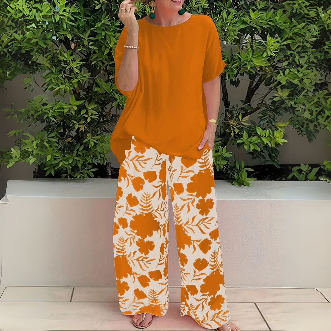 Animated gif showing the Nora two-piece floral set in motion, demonstrating the flow of the wide-leg pants