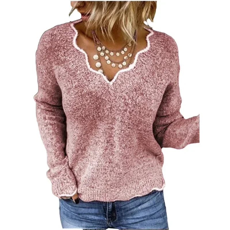 Front view of the Nora elegant sweater styled with high-waisted trousers for a chic everyday look