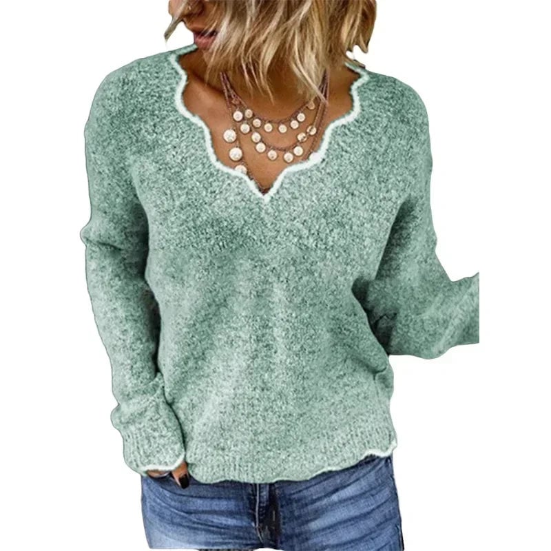 Nora elegant sweater in dark blue displayed on a model against a neutral background
