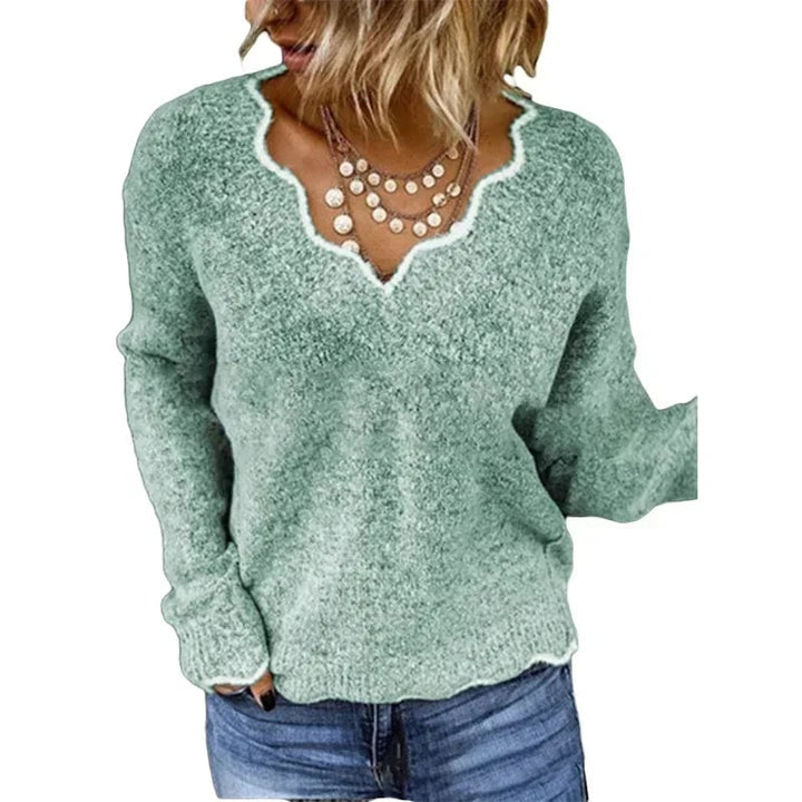 Nora elegant sweater in dark blue displayed on a model against a neutral background