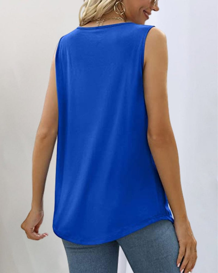 Model smiling in a white sleeveless square neckline top on a sunny day