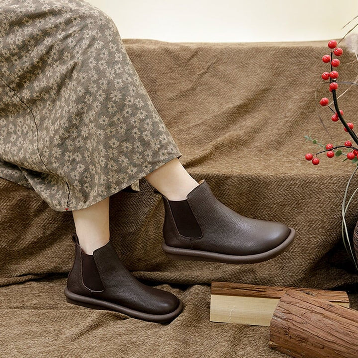 Nora slip-on boots styled with a casual outfit, side profile view