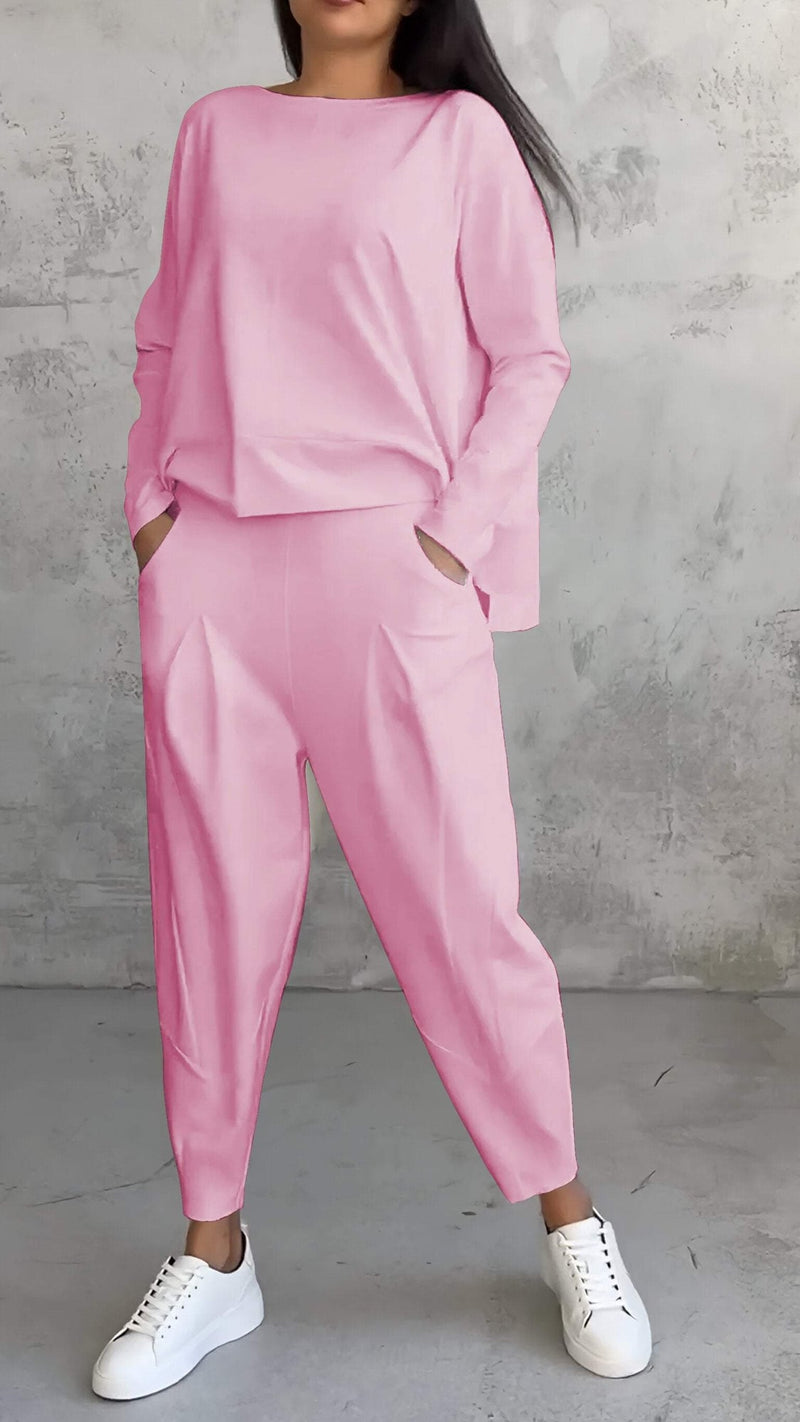 Close-up of the Nora lounge set off-white boat neckline and relaxed long-sleeve top detail