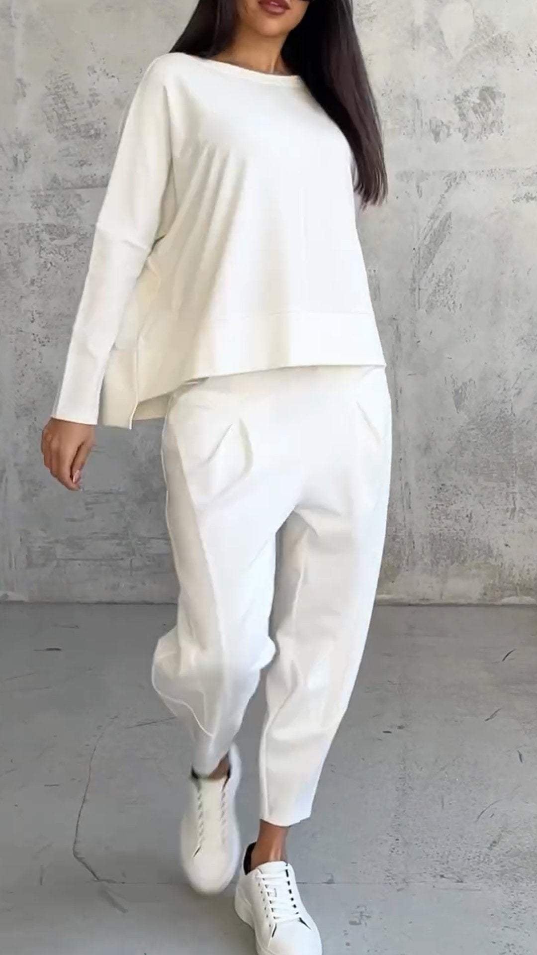 Flat lay of the Nora lounge set top and pants in multiple color options including black, red, and pink
