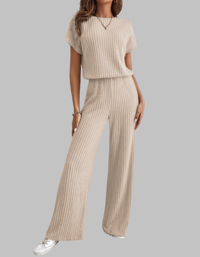 Woman wearing the Nora ribbed two-piece set in black with a short sleeve crewneck top and wide-leg pants