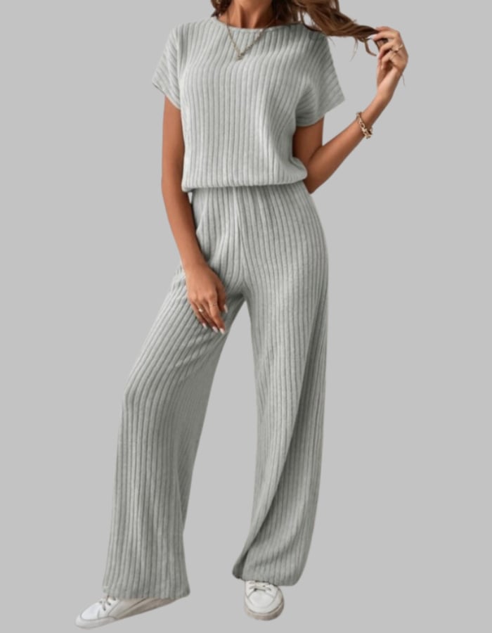 Woman styling the Nora ribbed set in blue with sandals for a casual daytime look