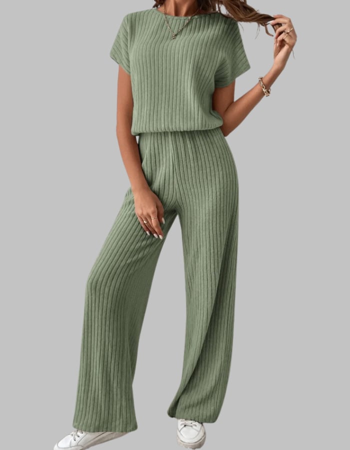 Full-length shot of the Nora ribbed set in gray showing the relaxed crewneck top tucked in