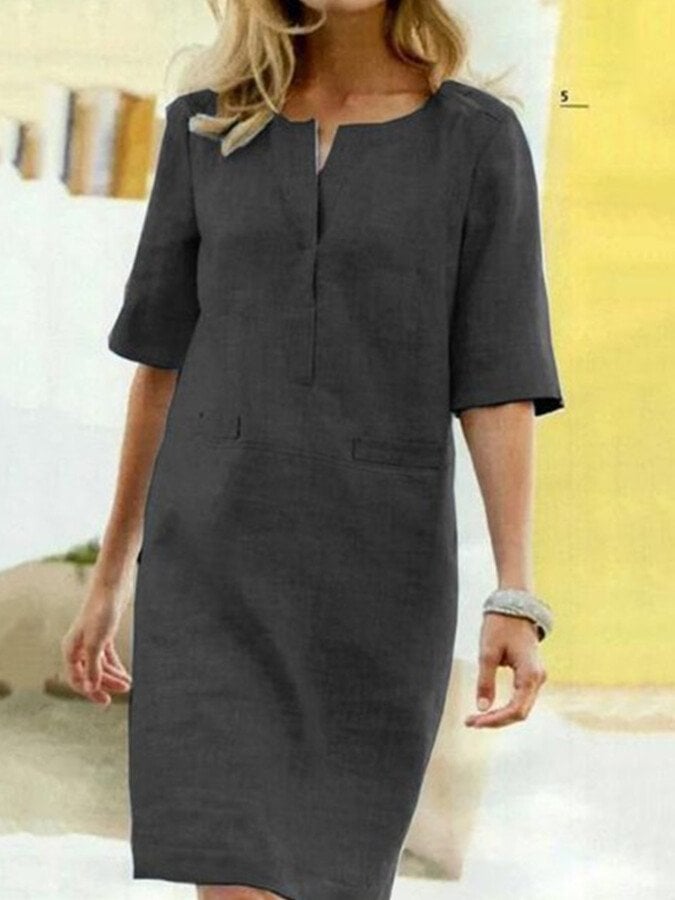 Flat lay of the Nora shift dress in Black showing the full silhouette, half sleeves, and linen-look fabric texture