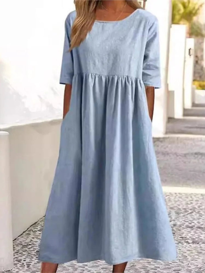 Side profile of woman in the Norah spring dress highlighting the relaxed, figure-skimming fit