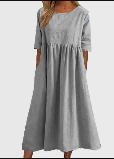 Flat lay of the Norah spring dress showing the A-line cut and clean design lines