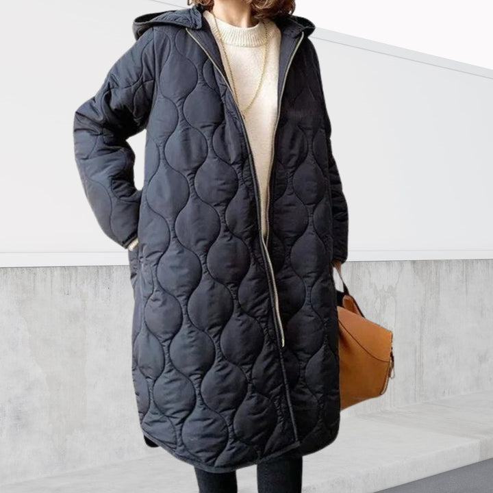 Animated gif showing the oversized hooded parka in multiple colors including marine blue and black on a female model