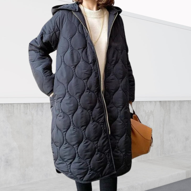 Animated gif showing the oversized hooded parka in multiple colors including marine blue and black on a female model