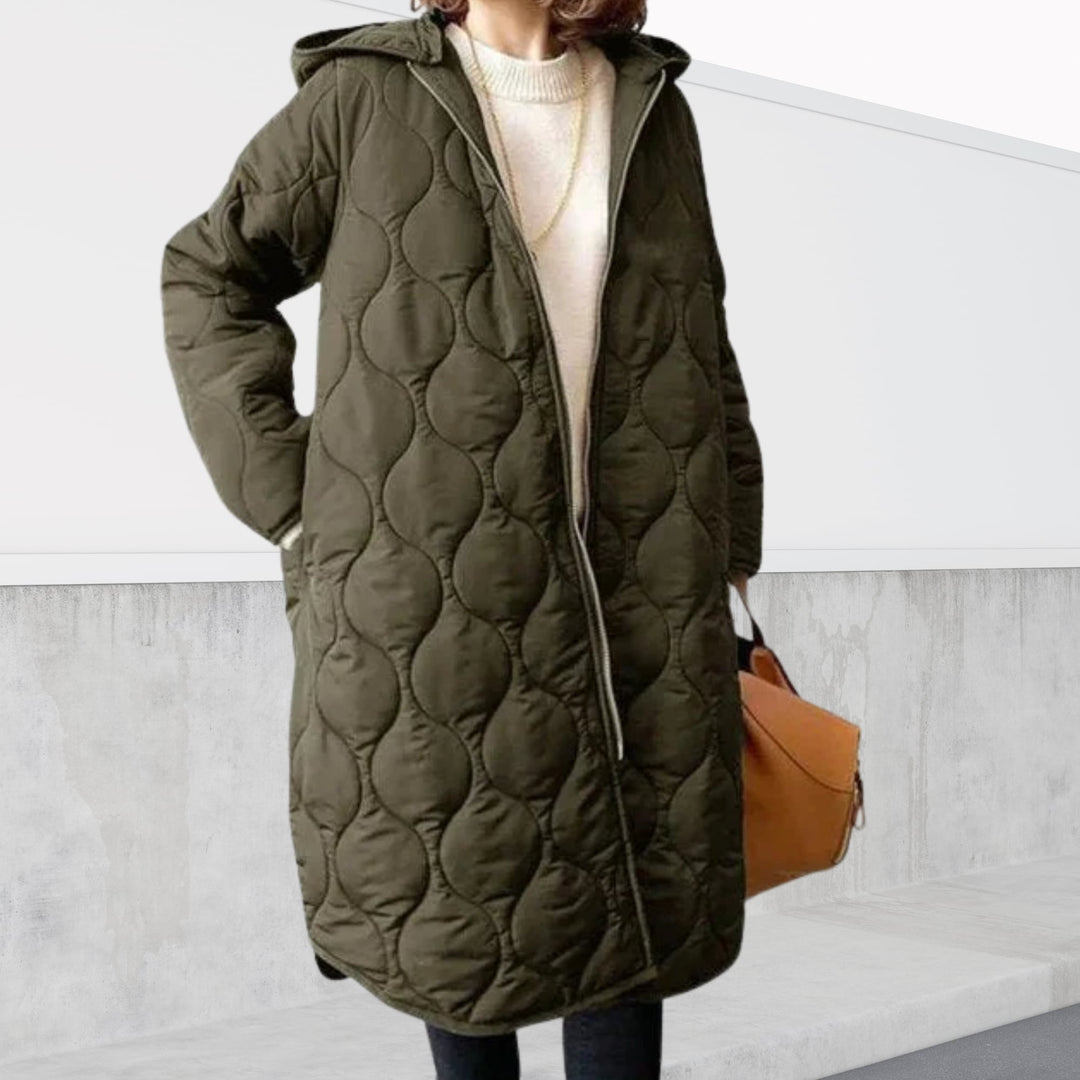 Front view of the oversized hooded parka showing the subtle argyle pattern and functional hood detail