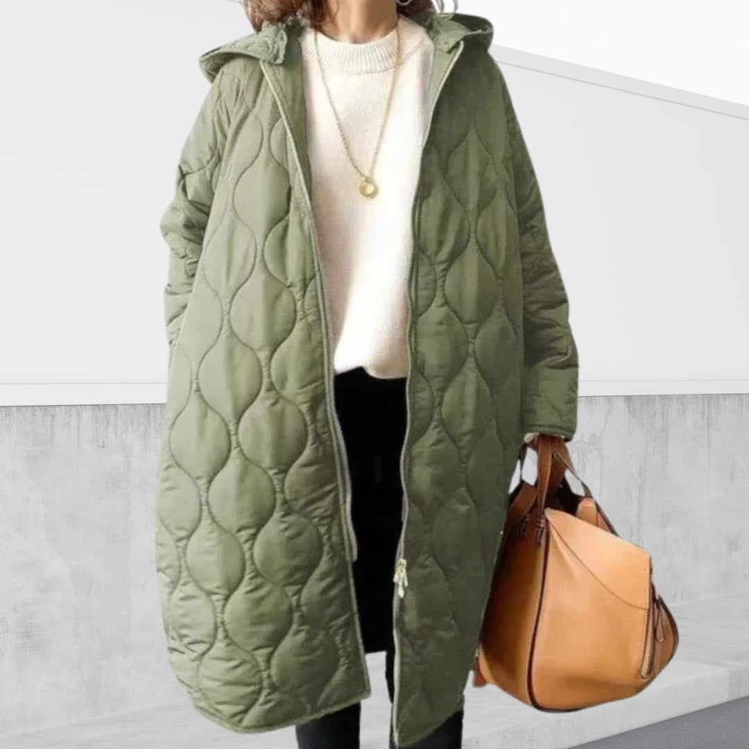 Close-up detail shot of the hooded parka highlighting the argyle texture and pocket placement