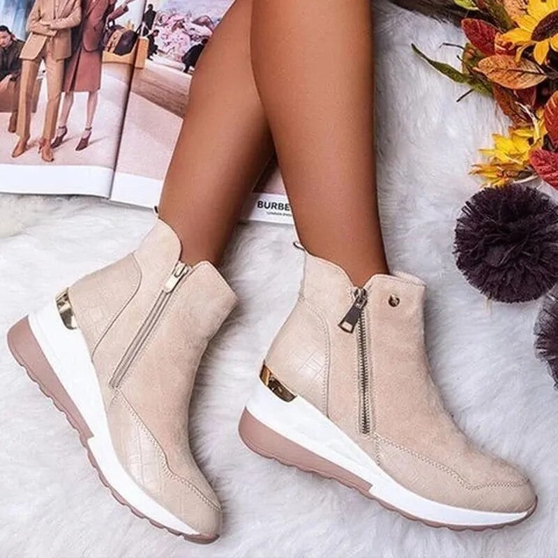 Women's orthopedic boot in a sleek silhouette showing cushioned insole and contoured sole detail