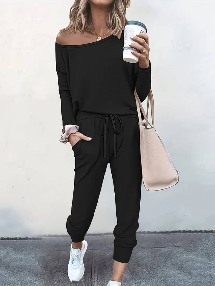 Model styled in the two-piece lounge set with sneakers for a casual everyday look