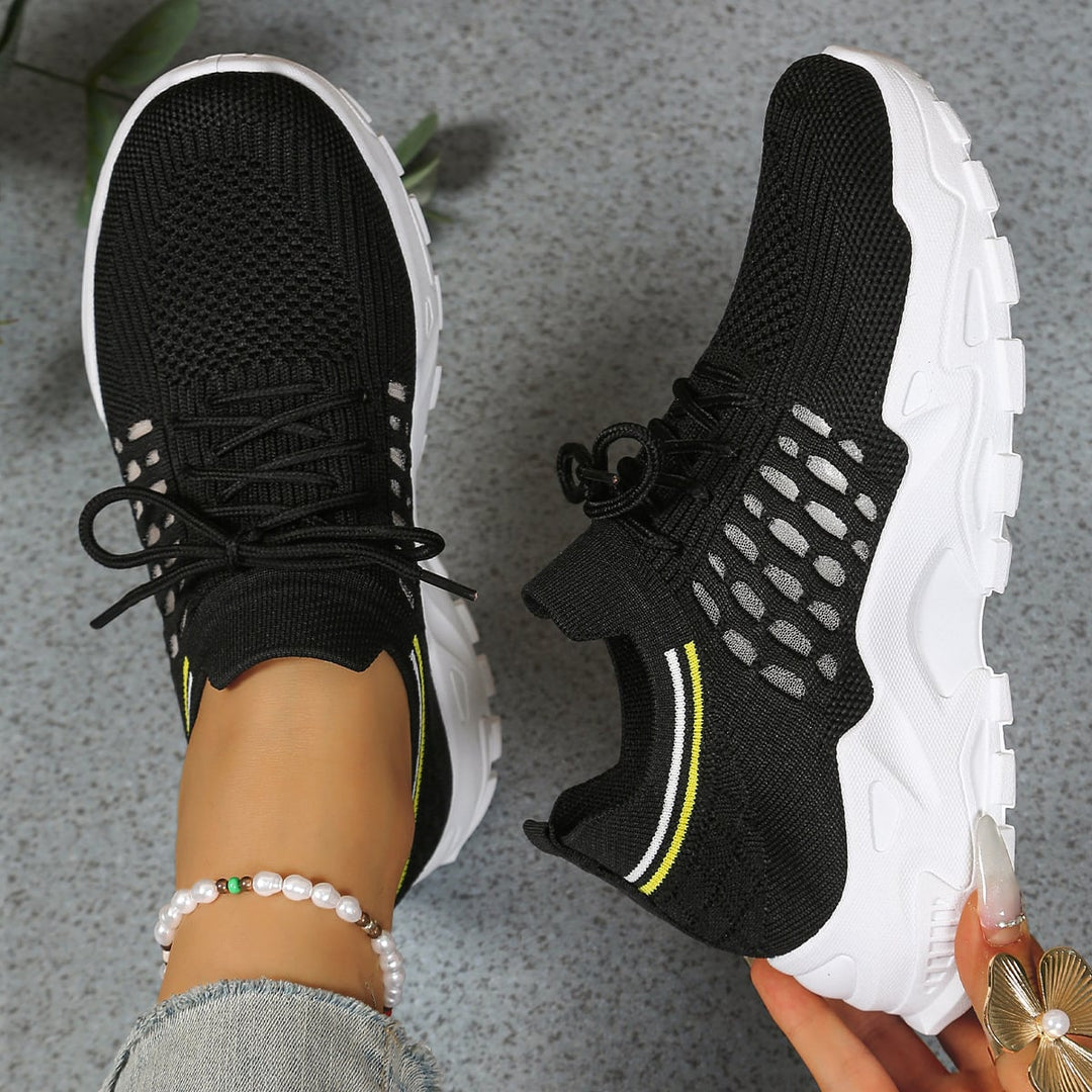 Nova chunky sneaker in black with lace-up closure and sculpted outsole, side profile