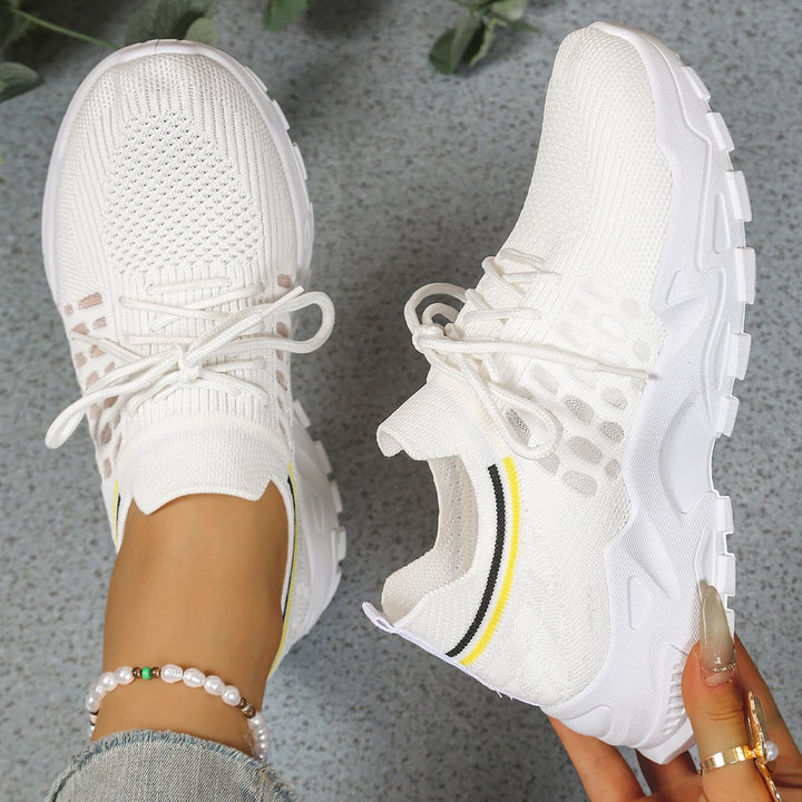 Nova women's walking sneaker in white, highlighting breathable mesh upper and thick platform sole