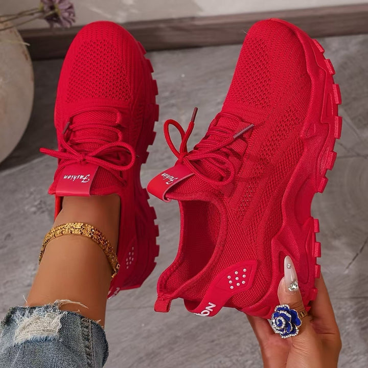 Nova lace-up sneaker in red, front three-quarter angle showing chunky sole detail