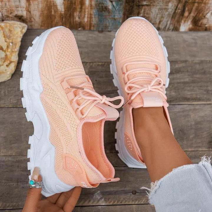 Nova women's chunky mesh sneaker in peach colorway, side view on clean background