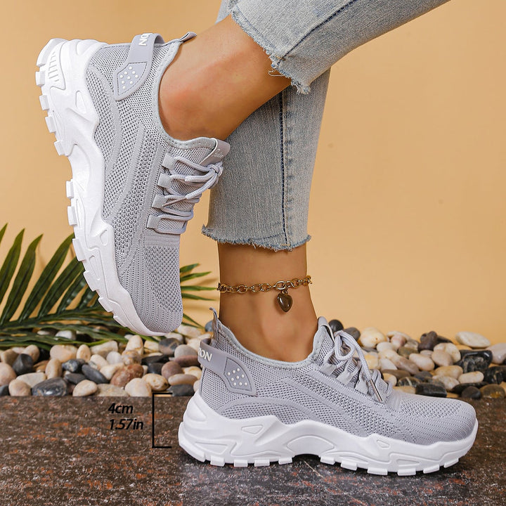 Nova platform walking sneaker in gray, showing full silhouette and lace-up fit