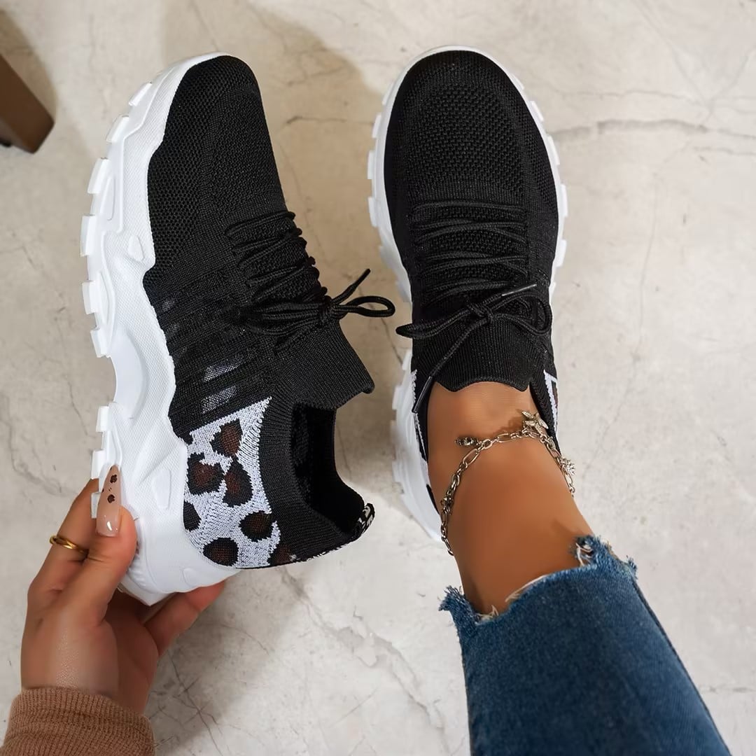 Nova sneaker in black and white colorblock, showcasing contrast sole and mesh upper