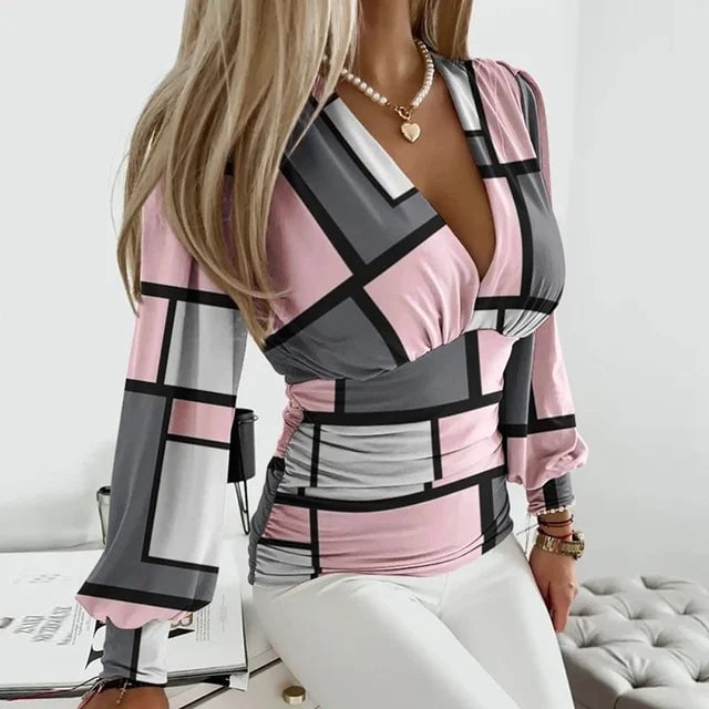 Full-length view of the Nova blouse in light green on a standing model