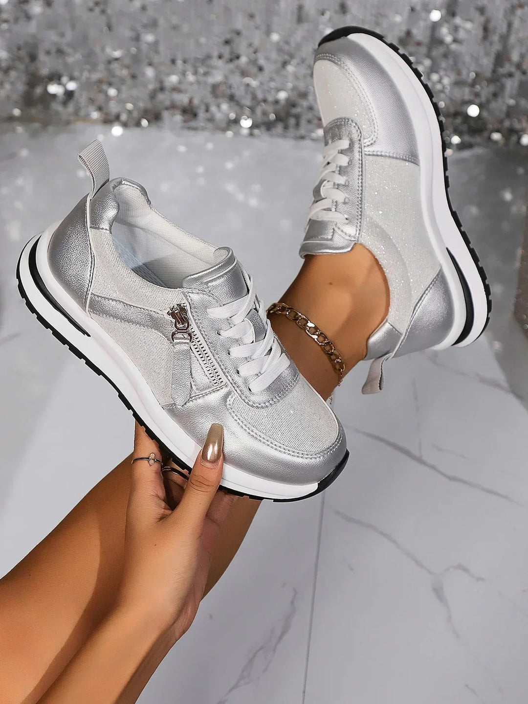 Nova metallic silver lace-up platform sneaker with side zip, front three-quarter view