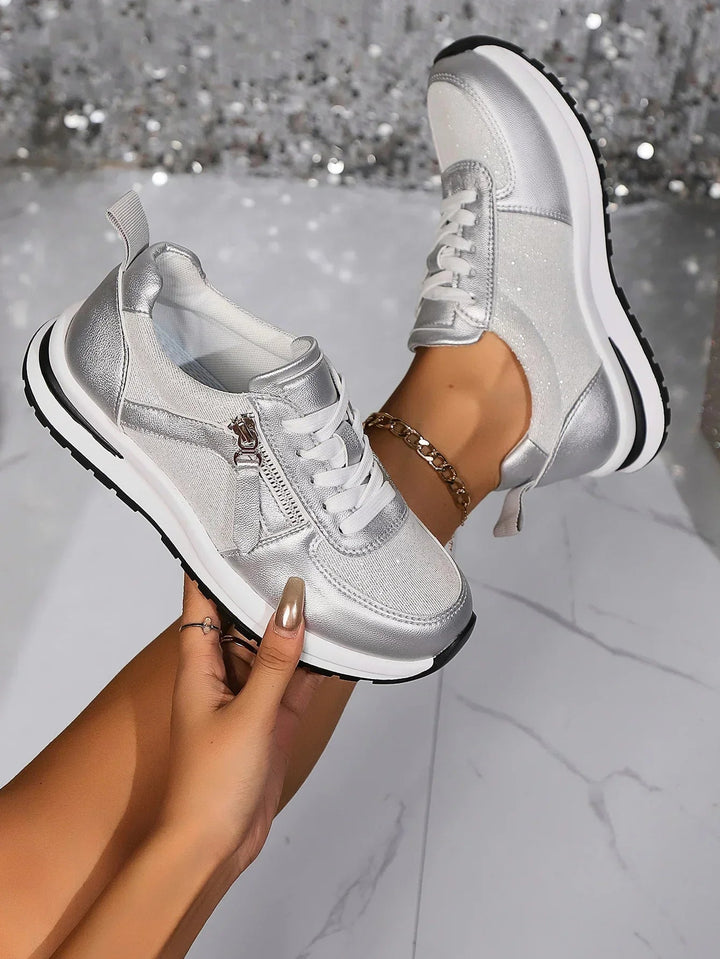 Nova metallic silver lace-up platform sneaker with side zip, front three-quarter view