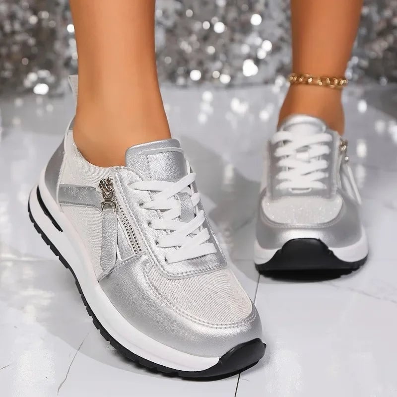 Nova silver sneaker close-up of side zipper and white laces
