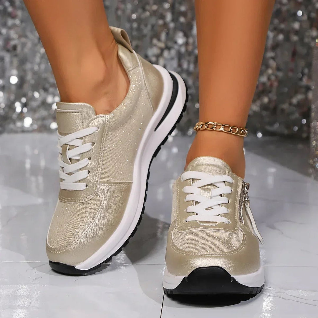 Nova gold platform sneaker heel and sole detail on white background
