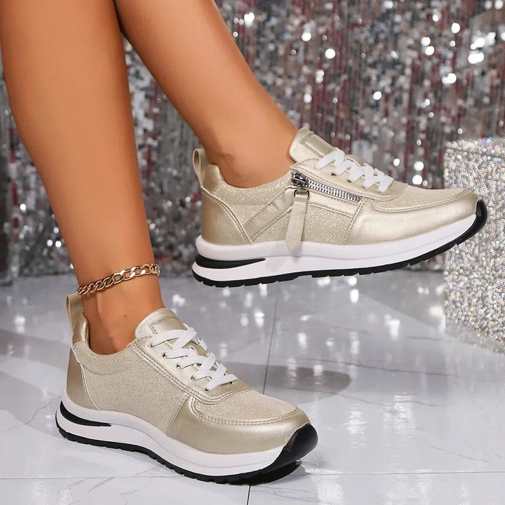 Nova gold sneaker top-down view showing lace-up closure