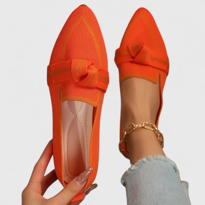 Pair of Nova women's loafers styled with tailored trousers, lifestyle shot
