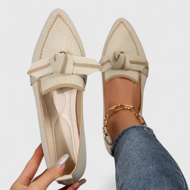 Nova pointed-toe loafers in khaki showing flat sole and contrast piping detail