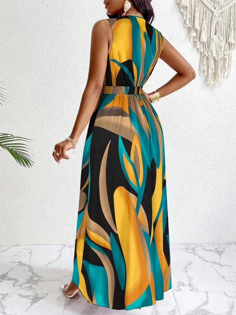 Front close-up of the Nova maxi dress showing the deep V-neckline and vivid abstract tropical print detail