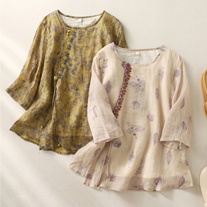 Front view of a cream floral embroidered relaxed blouse showing button front and collar detail