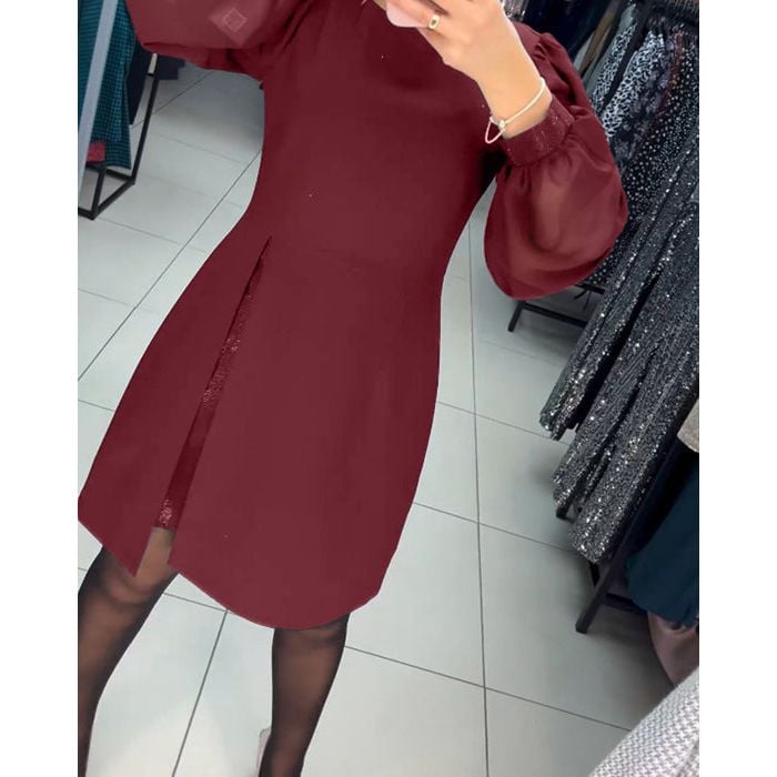 Full-length shot of the Nyla elegant timeless dress in black worn with heels