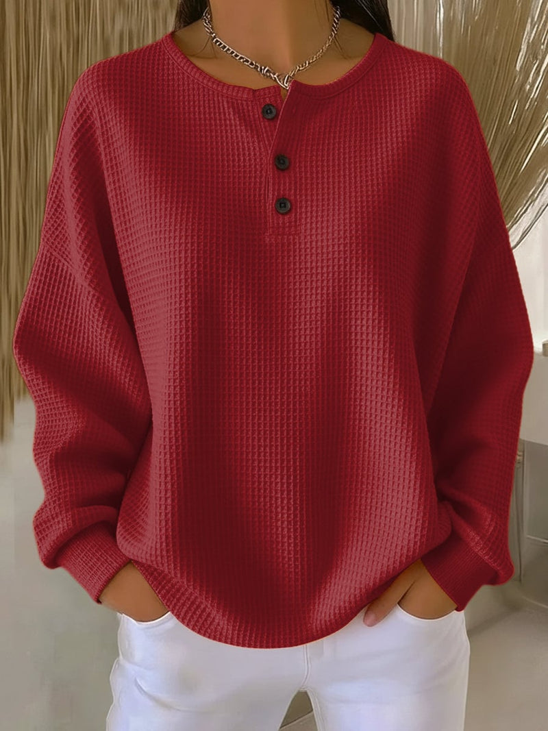 Front view of the casual sweatshirt styled with leggings, shown in white colorway