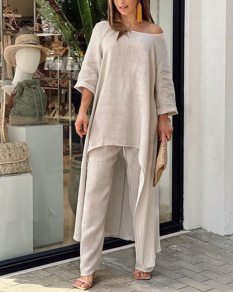 Front view of the Oasis off-shoulder longline tunic paired with matching wide-leg linen pants