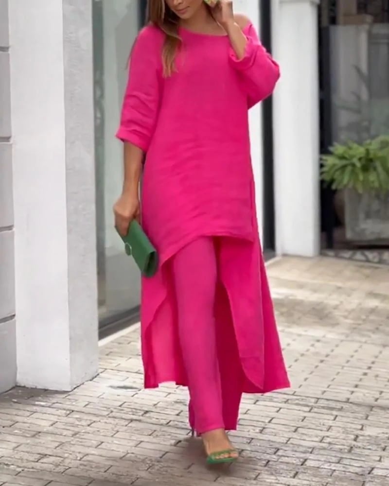 Close-up of the draped off-shoulder neckline on the Oasis linen tunic top