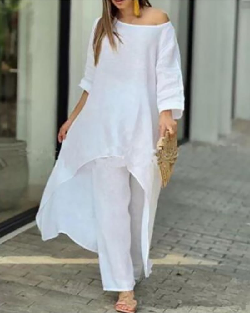 Woman styling the Oasis linen set with flat sandals for a resort-ready summer look
