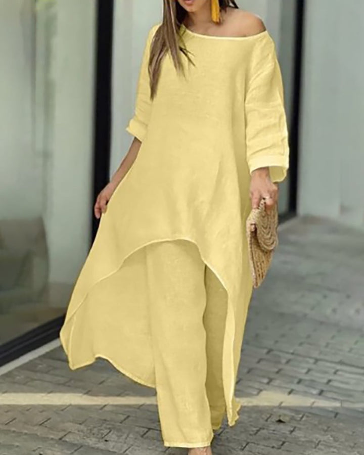 Flat lay of the Oasis linen tunic and wide-leg pants in green