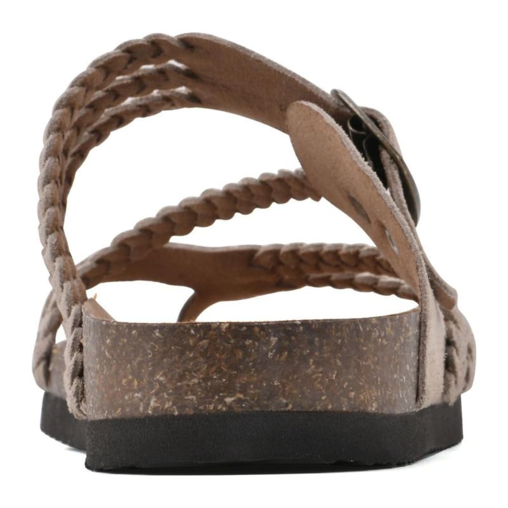 Octavia sandals in beige worn on feet against a light summer background