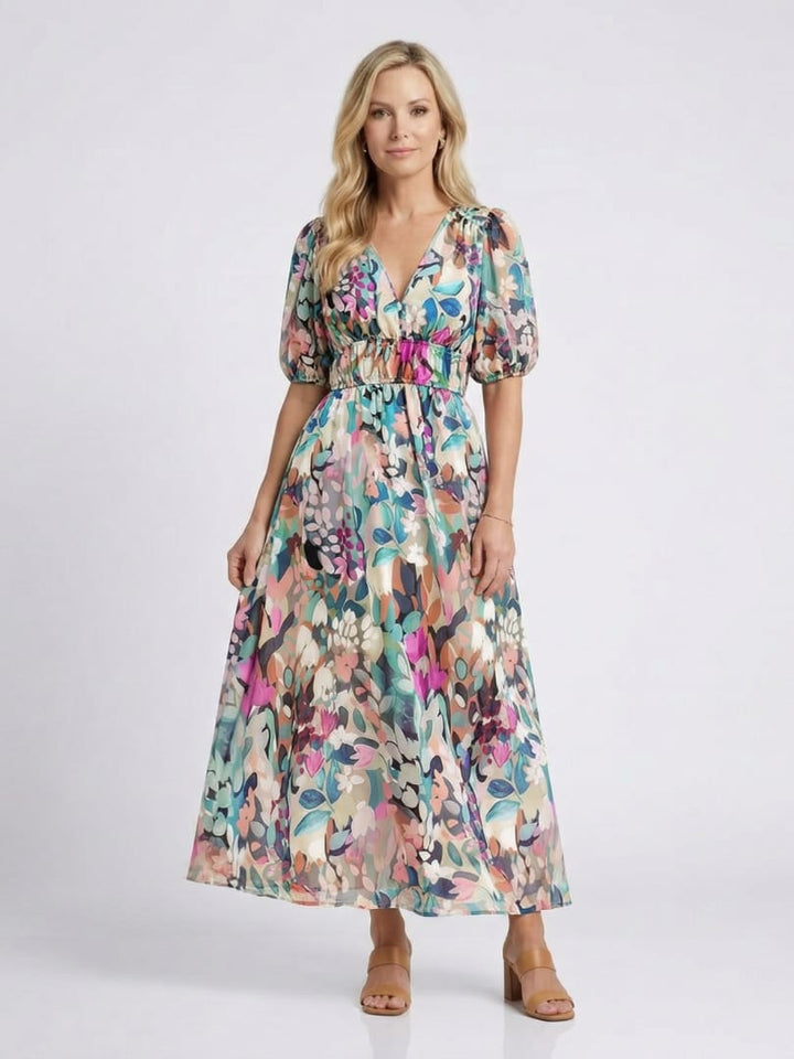 Women wearing the Octavia floral V-neck midi dress with vibrant botanical print and gathered waist, front view