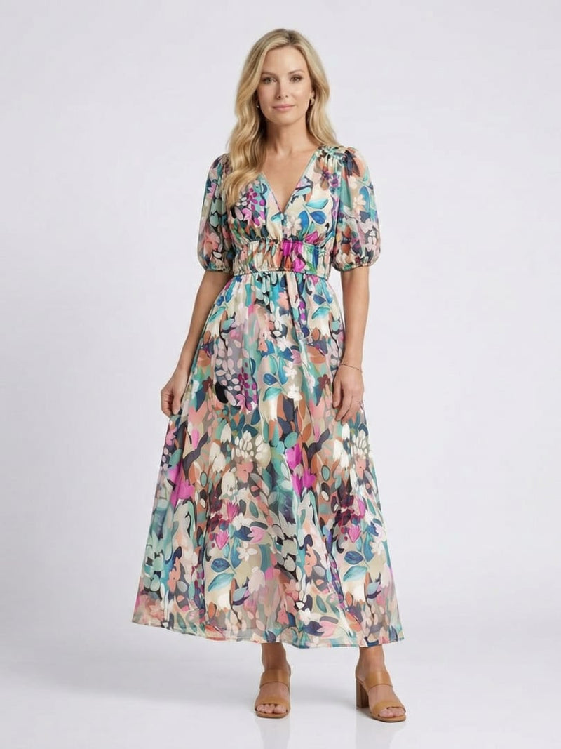Women wearing the Octavia floral V-neck midi dress with vibrant botanical print and gathered waist, front view