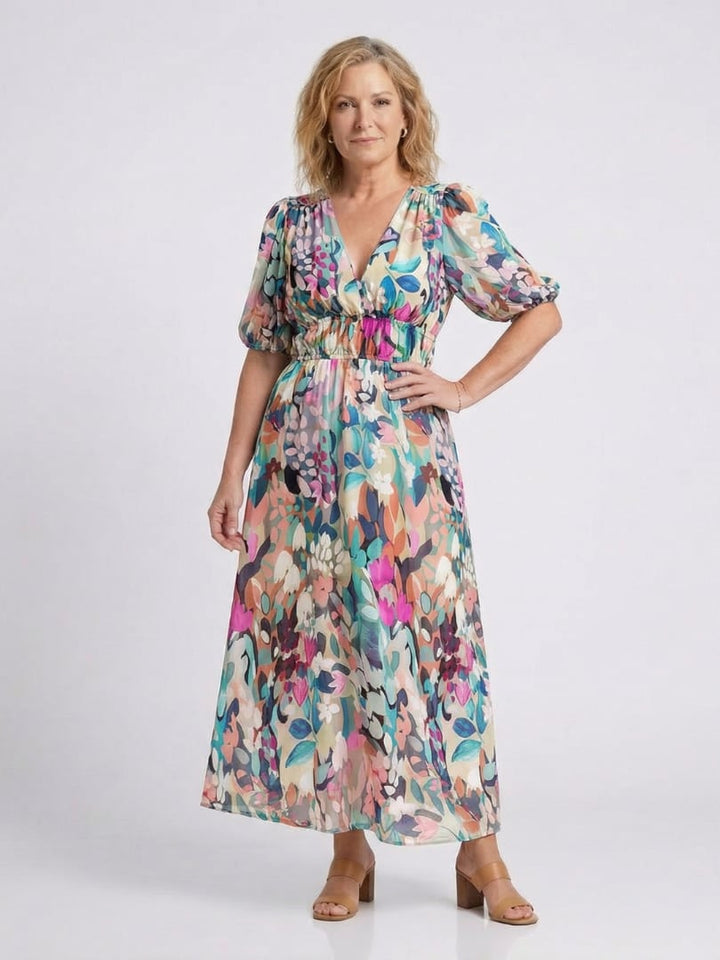 Side view of the Octavia floral midi dress highlighting the gathered waist and flowing midi-length skirt