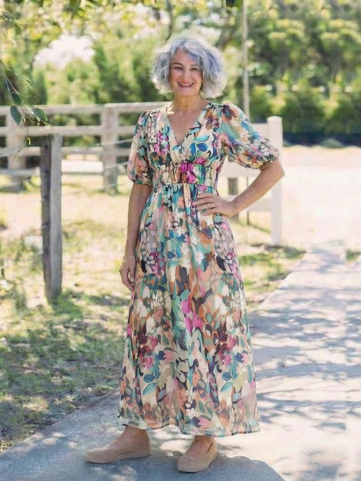 Full-length back view of the Octavia floral V-neck midi dress styled with sandals for a summer look