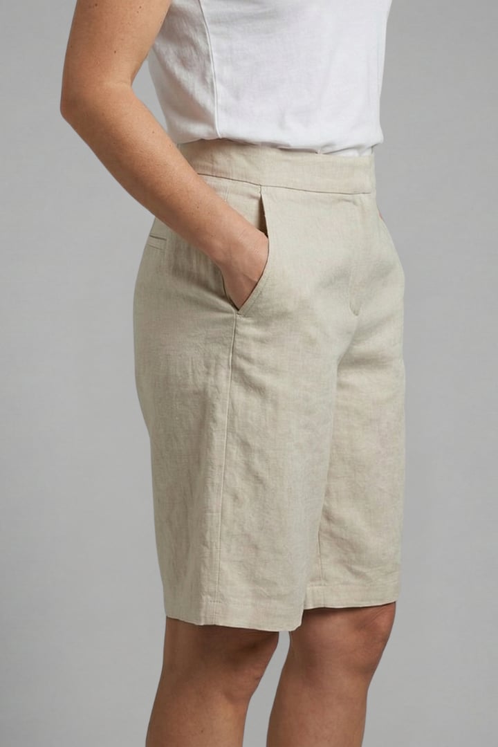Octavia high waisted shorts in black, styled with a tucked-in top
